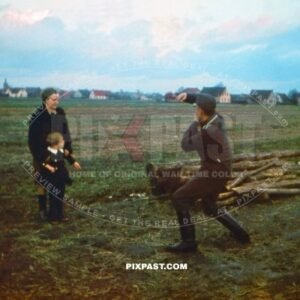 German Luftwaffe soldier photographing his son and wife in Leipzig 1942. Using a Leica camera in field.