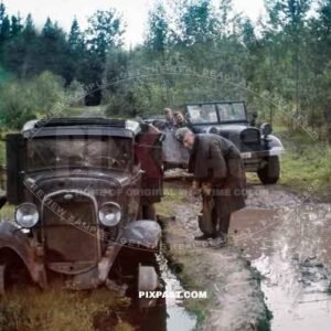 German Luftwaffe soldiers inspect destroyed Russian army truck on the outside of Minsk June 1941. Kessel.