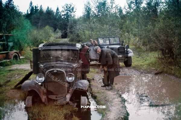 German Luftwaffe soldiers inspect destroyed Russian army truck on the outside of Minsk June 1941. Kessel.