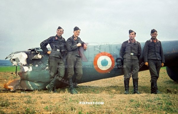 German Luftwaffe troops inspect the rear section of a French Bloch MB-174 French Reconnaissance bomber plane. 1940