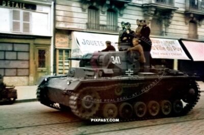 German Panzer 3 Tank No. 341 entering the bombed city of Loreans France 20.6.1940 France.