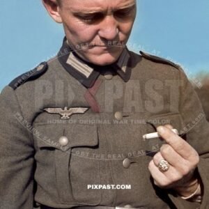 German Private army soldier in uniform smoking a cigarette. Large gold ring on finger. 4th Panzer Division France 1940