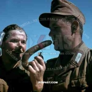 German War Photographer Fritz Moosmueller eats german sausage in Tunisia 1942. 90th Light Infantry Division.
