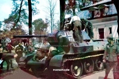German Wehrmacht Beutepanzer T34 being repaired and repainted with Balkan cross. Stalingrad area 1942.