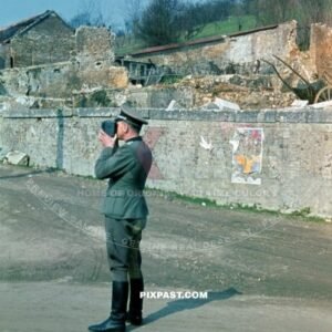 German Wehrmacht Infantry officer of the 6. Infantry Division makes a 8mm home movie film in destroyed French village 1940