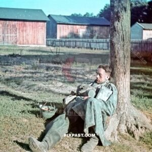 German Wehrmacht Kradmelder Motorbike messenger in rain jacket sleeping in Polish farm. Poland 1939