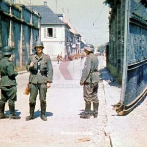 German Wehrmacht soldiers guarding large steel French town fortified gates. France 1940