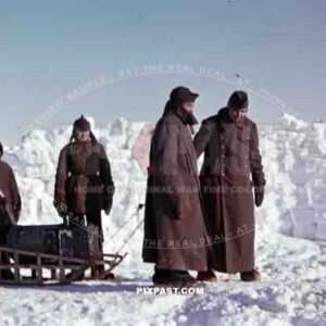 German Wehrmacht soldiers infantry pulling snow sled with food and ammunition in snow field Finland 1943