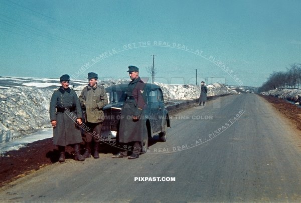 German army Jager hunting unit beside their Opel Olympia staff car in Norway 1942