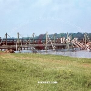 German army Pioneer unit building temporary pontoon war bridge over river. South of Paris France 1940. Blitzkrieg.
