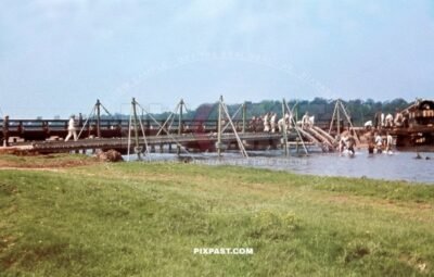 German army Pioneer unit building temporary pontoon war bridge over river. South of Paris France 1940. Blitzkrieg.