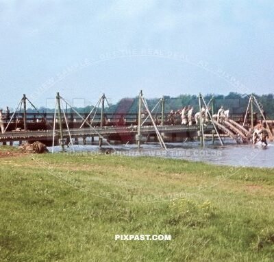 German army Pioneer unit building temporary pontoon war bridge over river. South of Paris France 1940. Blitzkrieg.