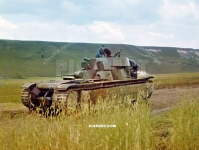German army officer climbing on a T-35 multi-turreted heavy tank for inspection. 19th Panzer Division Russia 1941