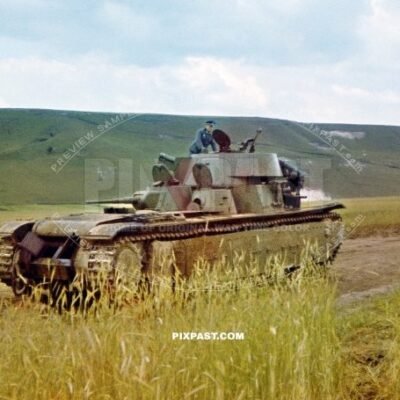 German army officer climbing on a T-35 multi-turreted heavy tank for inspection. 19th Panzer Division Russia 1941