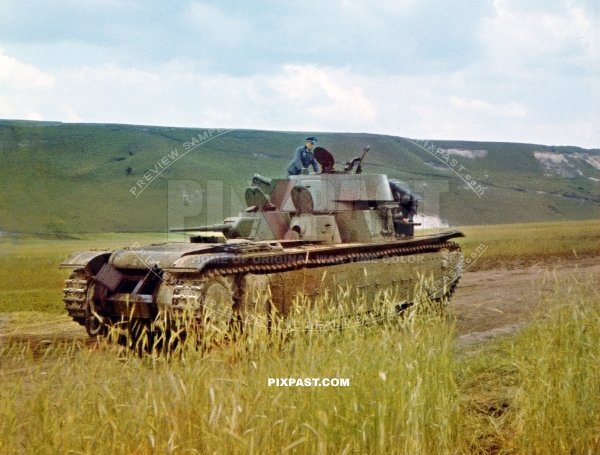 German army officer climbing on a T-35 multi-turreted heavy tank for inspection. 19th Panzer Division Russia 1941