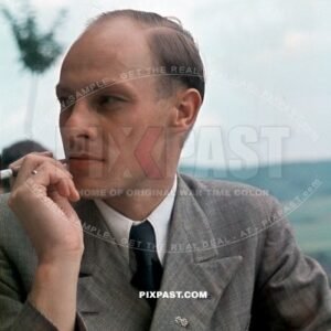 German army officer in civilian clothing wearing iron cross miniature medals. Lindau 1944 Germany