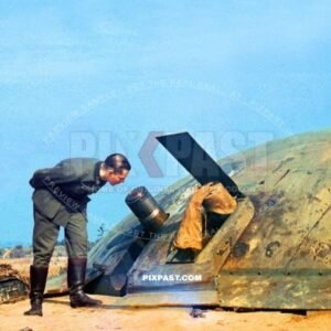 German army soldier inspecting captured French Maginot Bunker cannon in France 1940. Occupation. Blitzkrieg.