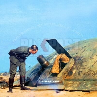 German army soldier inspecting captured French Maginot Bunker cannon in France 1940. Occupation. Blitzkrieg.