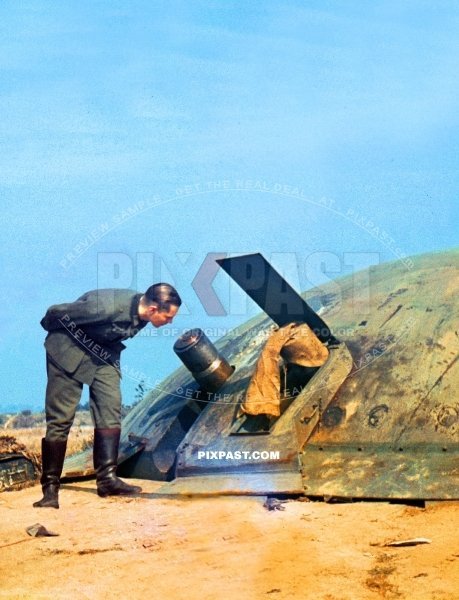 German army soldier inspecting captured French Maginot Bunker cannon in France 1940. Occupation. Blitzkrieg.