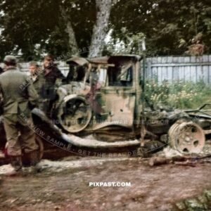 German army soldiers inspecting a burned out destroyed Russian army GAZ truck. 297 Infantry Division