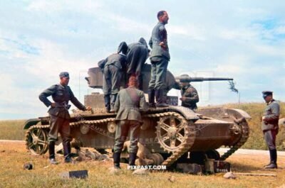 German army soldiers inspecting a captured Russian Soviet T26 light panzer tank. Russia 1941