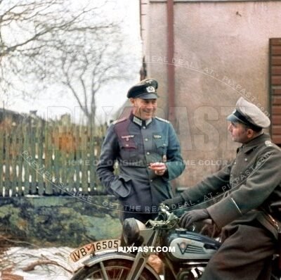 German artillery officer talking with motorbike Kradmelder on Westfront France German border 1939. 14th infantry division