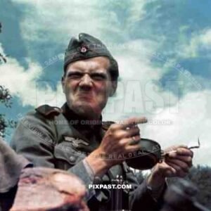 German artillery soldier near French coast France 1940 not enjoying his food rations.