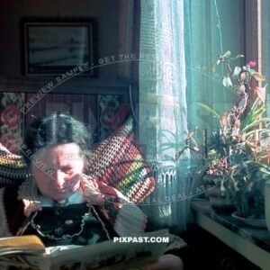 German granny sitting down reading the newspaper. Bavaria Germany 1939