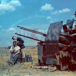 German hair dresser beside 20mm Flakvierling 38 Anti-Aircraft Gun on outshirts of Stalingrad Summer 1942