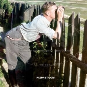 German infantry officer using his field binoculars in France 1940. 297 Infantry Division.