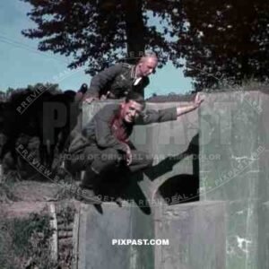 German infantry soldiers inspecting captured French Maginot Line bunker. France 1940.