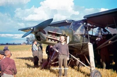 German medical orderly with Luftwaffe Fieseler Fi 156 Storch red cross medial ambulance plane. Russia 1941