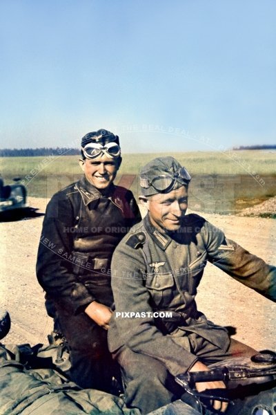 German panzer army commander on the back of a BMW motorbike kradmelder on dusty Russian road. Summer 1942