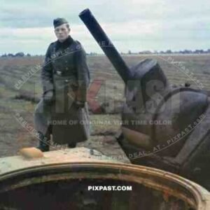 German soldier inspecting the destroyed turret of a Russian Soviet KV 1 Heavy Tank. Russia 1941. Kliment Voroshilov