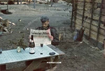 German soldier reading propaganda newspaper Lappland Kurier about the Dieppe Raid August 1942.