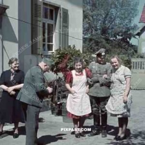 German soldier taking photograph with camera of soldier and women near Wiesbaden, Germany, 1939