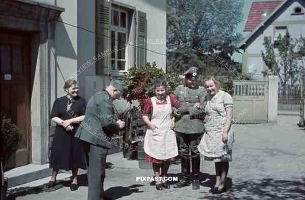 German soldier taking photograph with camera of soldier and women near Wiesbaden, Germany, 1939