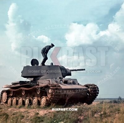 German soldiers climbing on a Kliment Voroshilov KV1 Heavy Russian tank for inspection. 19th Panzer Division Russia 1941