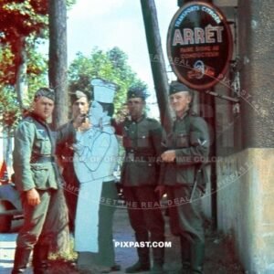 German soldiers from the 4th Panzer Division stand in front of a French restaurant. Transports Citroen Arret France 1940