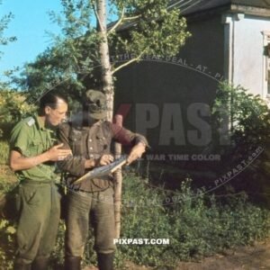 German soldiers inspecting a map and smoking cigarettes. 97. Jager Division July 1942 Rostow Russia
