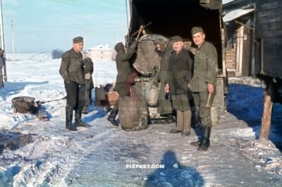 German soldiers transporting drinking water in large wooden fass in opel truck. Crimea Krim winter 1943