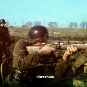 German soldiers wearing M40 helmet and training with a KAR 98 rifle. Russian Front 1943