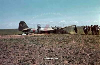 Germans capturing crash landed Russian Ilyushin IL-4 Bomber. Crew standing beside plane. 3rd Panzer Division, Beresina 1941.