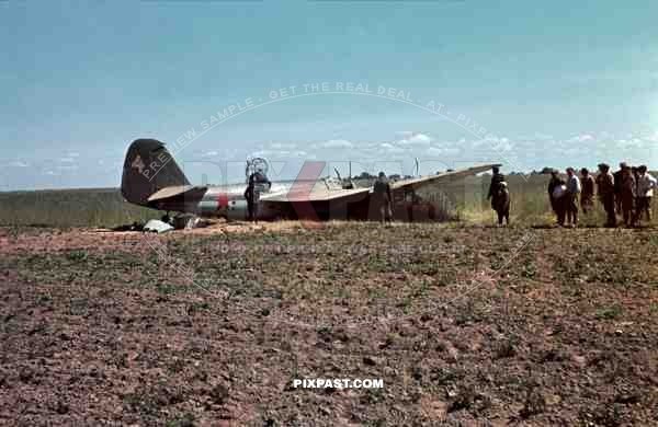 Germans capturing crash landed Russian Ilyushin IL-4 Bomber. Crew standing beside plane. 3rd Panzer Division, Beresina 1941.