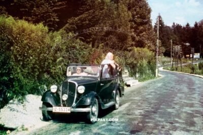 Germany family with black car from Rheinprovinz go on summer holiday 1938. Idar Oberstein. the Felsenkirche.
