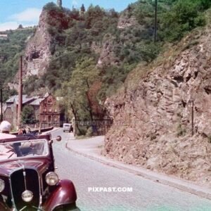 Germany family with red car from Rheinprovinz go on summer holiday 1938. Idar Oberstein. the Felsenkirche.
