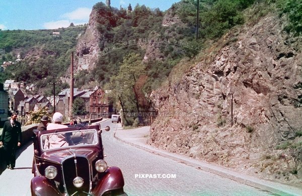 Germany family with red car from Rheinprovinz go on summer holiday 1938. Idar Oberstein. the Felsenkirche.