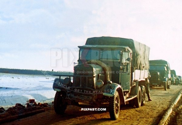 Germany heavy army truck driving towards Moscow with gas mask on the night lights. Gzhatsk Gagarin 1942