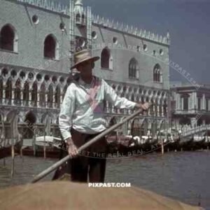 Gondolier on boat in Venice, Italy 1943
