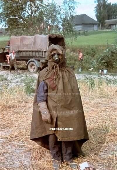Hauptmann Heinz Jarmer dressed in zeltbahn jacket with gas-mask and gloves in Russia 1941. 3. Panzer Brigade. 3RD Panzer